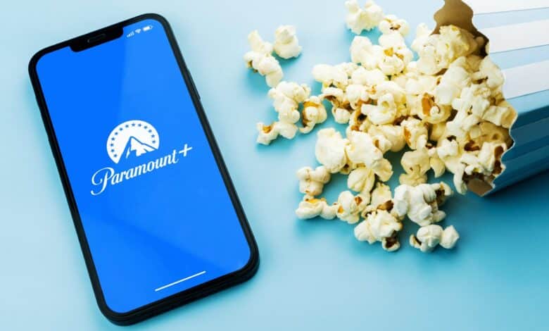 Paramount Plus app on a phone next to popcorn