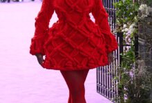 Joy Sunday Wore McQueen To The ‘Wednesday’ Season 2 London Premiere red knit dress and red hat