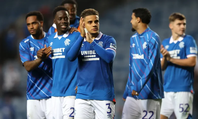Max Aarons applauds the Rangers fans at the end of a game