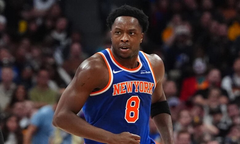 Nov 25, 2024; Denver, Colorado, USA; New York Knicks guard Jalen Brunson (11) reacts towards forward OG Anunoby (8) in the second quarter against the Denver Nuggets at Ball Arena. Mandatory Credit: Ron Chenoy-Imagn Images